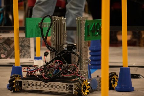  Robotics Team Robot returning back after successfully placing a cone onto one of the center yellow pylons. Putting a cone onto a pylon scores points for your team while potentially blocking the opponents cones below it