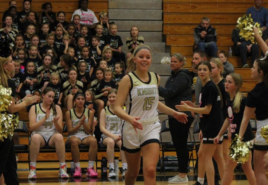 Junior Kendra Swope runs down the line before the game.