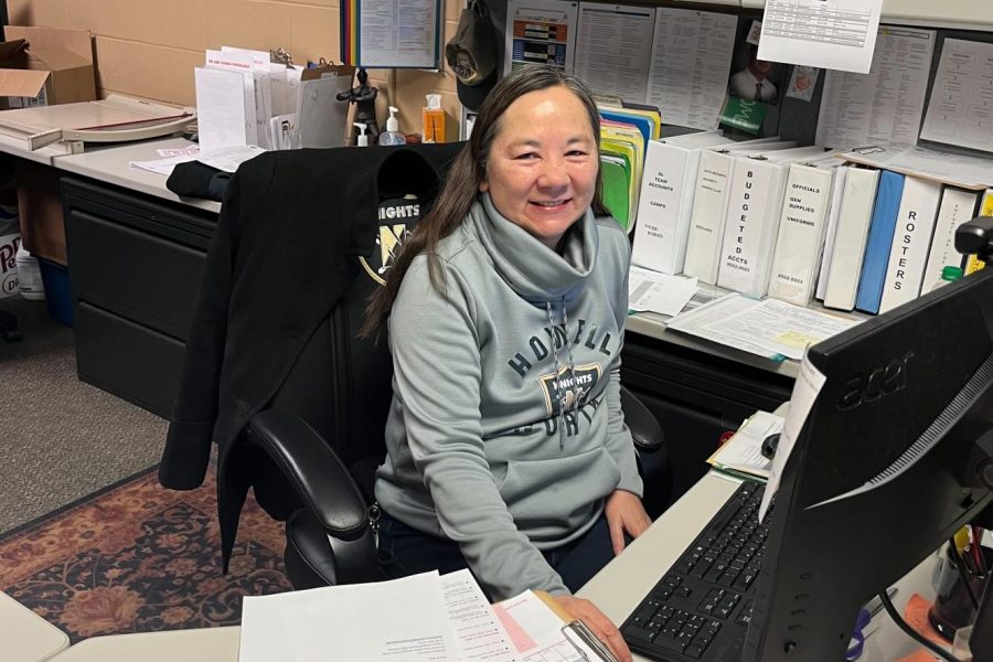 Arlene Kearns sits at her desk in the activities office.