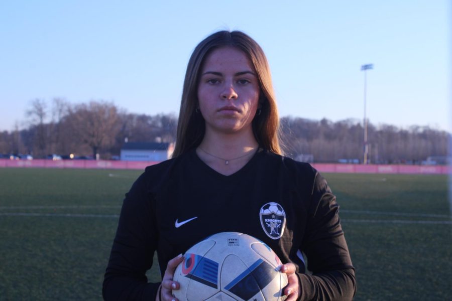 Senior AnnaRose Eldred stands on the soccer field before her final season of high school soccer starts. Eldred has played a key role in      the Lady Knights success throughout her high school career.