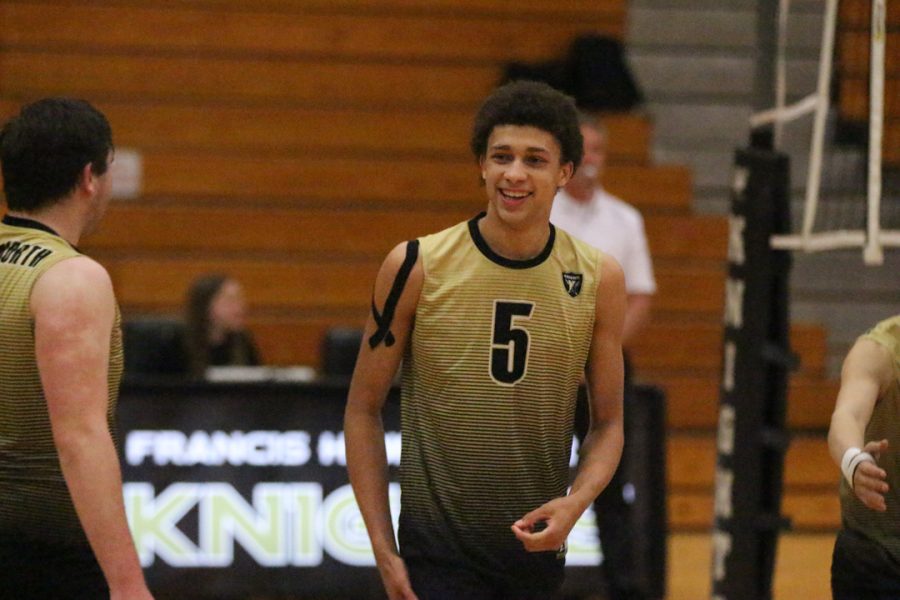 Walter Hammond plays in a varsity volleyball game. Hammond recently returned to volleyball after leaving for a year.