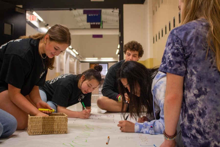 Students works on a project for sun club. 