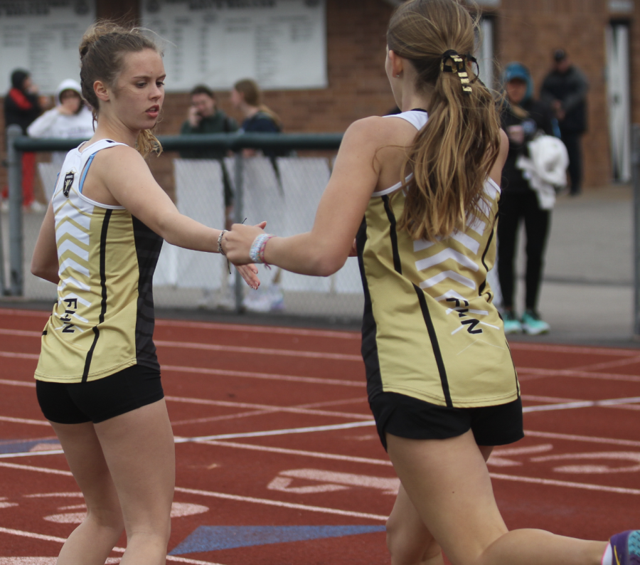 Freshman Katie Head hands participates in a track meet. 