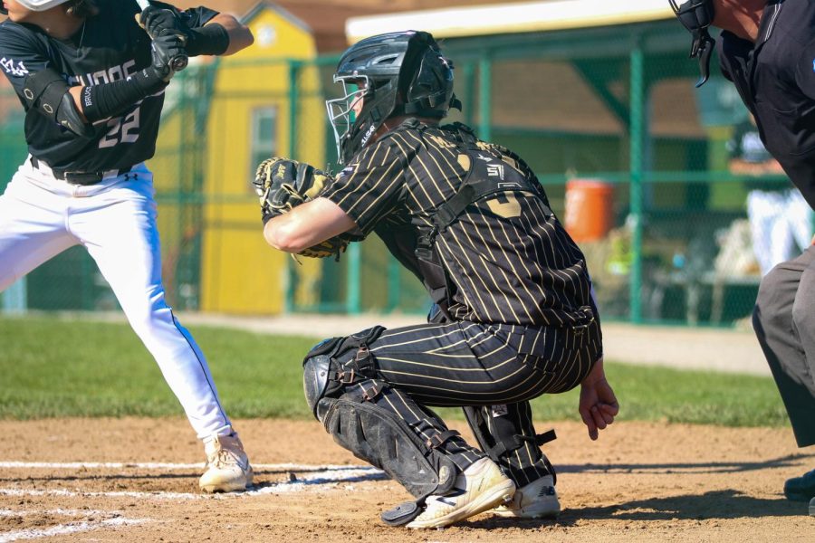 On April 11, Senior Patrick Martinez plays a baseball game as a catcher. The Knights took a 1-3 win.