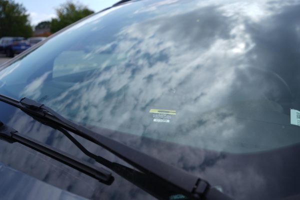 A parking pass sits in an upperclassmen's car. 