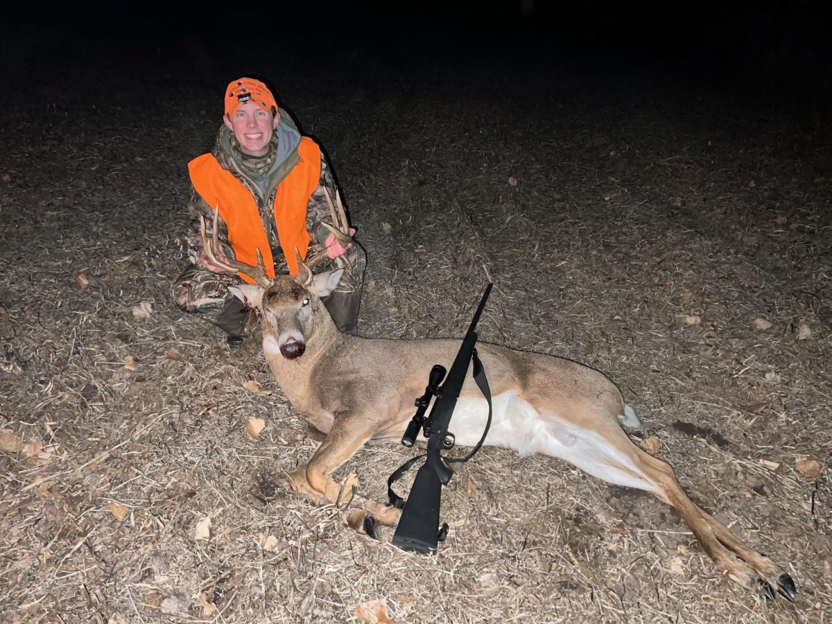 Hunter Grashoff holds a deer that he aquired from hunting. 