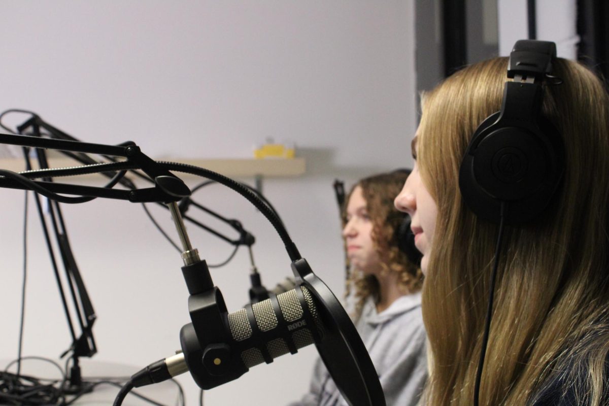 Juniors Laney Quandt and Bri Dunham record in the podcast studio for FHNtoday. There are currently four different podcasts on FHNtoday; “Music Mayhem,” “Fashion History Update,” “The Podcast Chronicles,” and “Class of 2024 Reflections.”