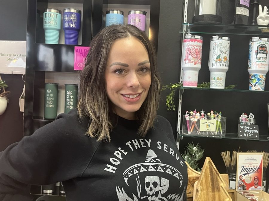 Amber Anians stands proudly in the store that she created.