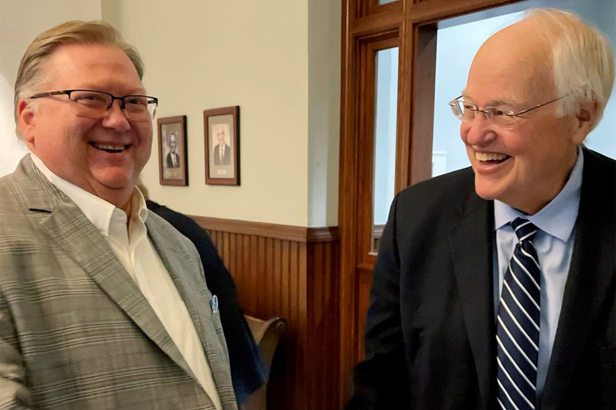 Buddy Hardin shakes hands with Steve Ehlmann. 