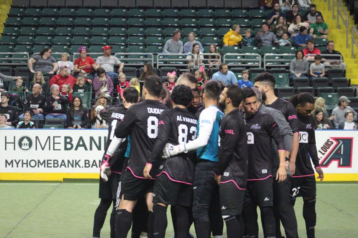 The STL Ambush hold a group huddle mid game