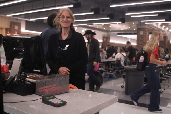 Mary Rascher helpS students get their lunch at FHN cafeteria. She also handles all finance in the cafeteria.