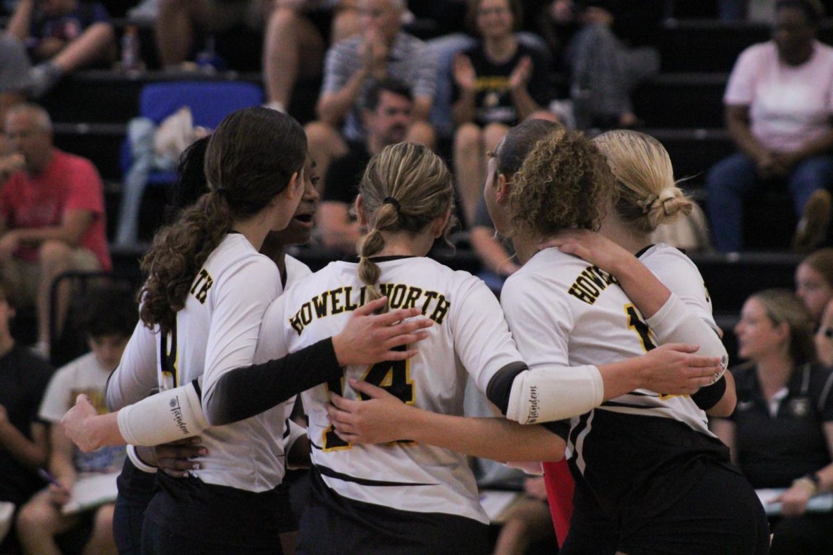 Varsity girls volleyball huddles together
after winning a point during a home game against Pattonville on Sept. 4. Pirates took the lead until the end beating the Knights 0-3. 