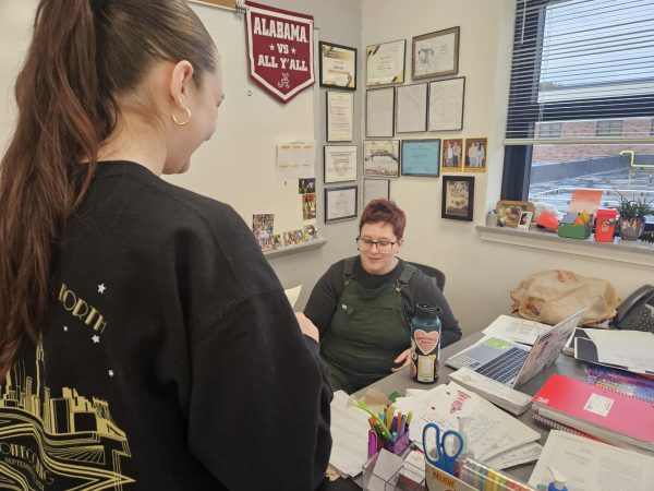 Ashley Seiss and student in her freshmen English one class talk about the curriculum.