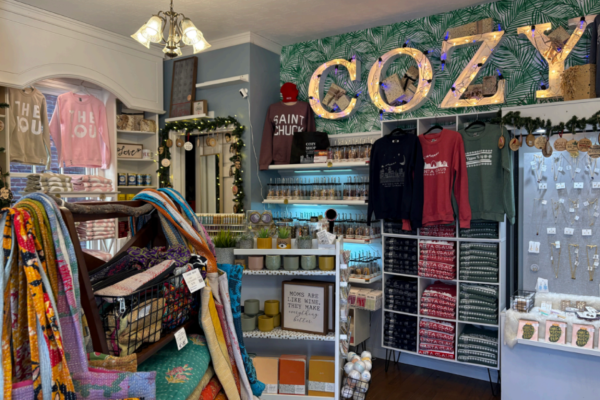 Inside the Cozy shop with numerous types of clothing on display to get ready for the holiday season. The store offers items from candles to sweatshirts. Every season of the year they try to deck the establishment with delightful scenery.