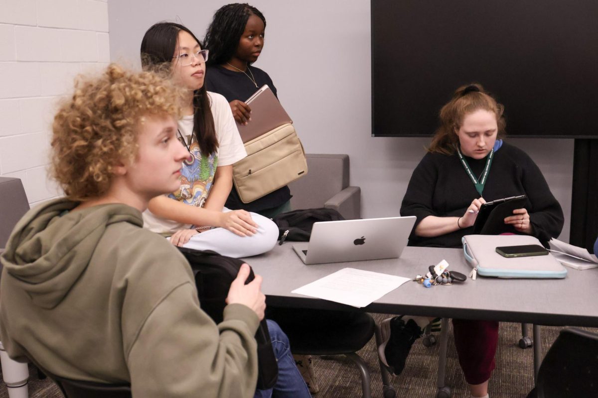 Mock Trial members discuss the events of the night’s practice trial while
preparing for the preliminary competitions.