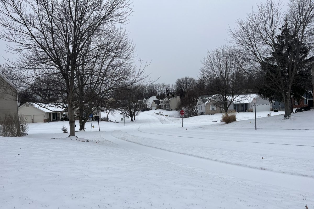 Snow blankets the streets in a district neighborhood