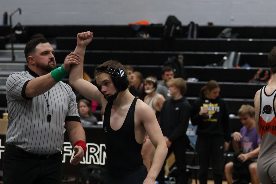 Freshman Noah Brown walks of the mat Dec. 5 after winning a match. FHN’s wrestling team competes in their first quad of the season against Palmyra, St. Charles West and hosting team Orchard Farm. 