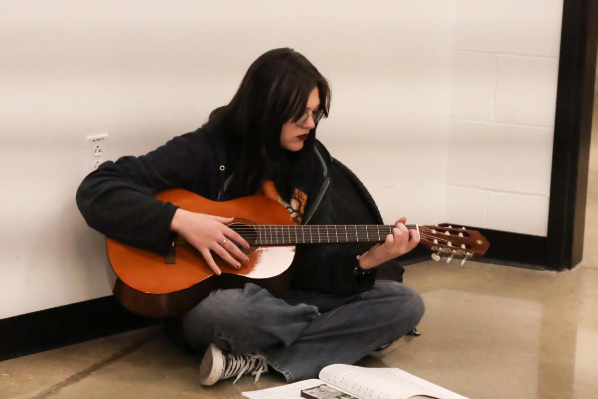FHN student plays guitar in Curtis's class