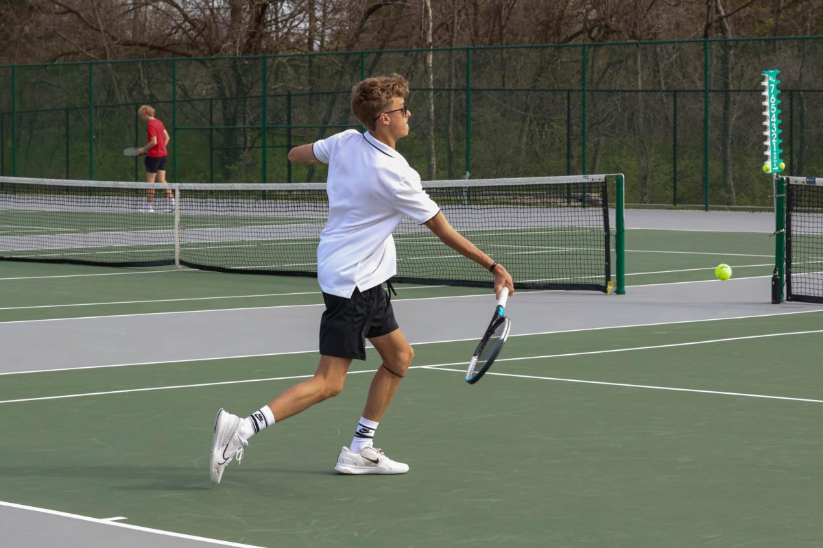 Junior Caleb Couch prepares for a underhanded swing while playing against Liberty on April 1. 