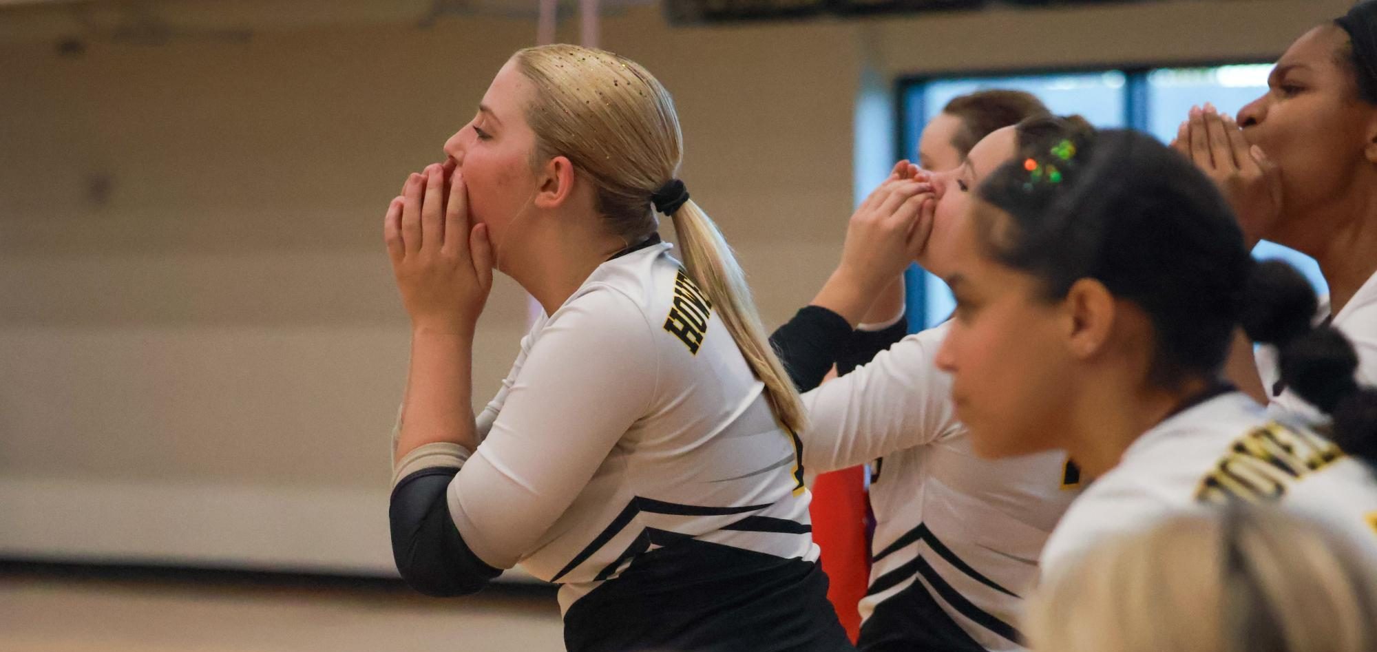 Kylie Feigenbaum cheers on teammates during Senior Night game against Warrenton on Sept. 25. The Knights won in 4 sets against the Warriors.