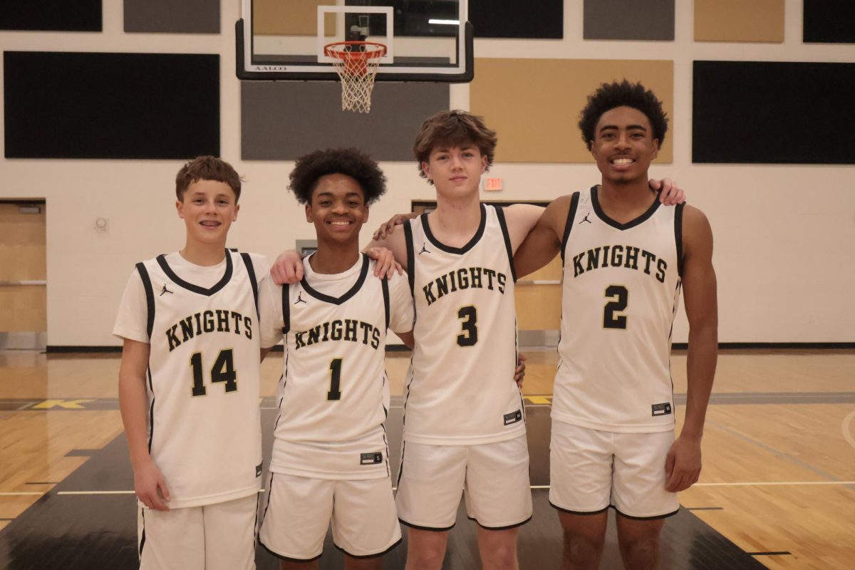 Freshman Cohen Oster, sophomore Issac Butler, junior Trace Hunter, and senior Andre Stith pose
together.