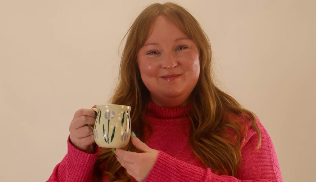 Kelsie Lee holds a mug that she created herself. 