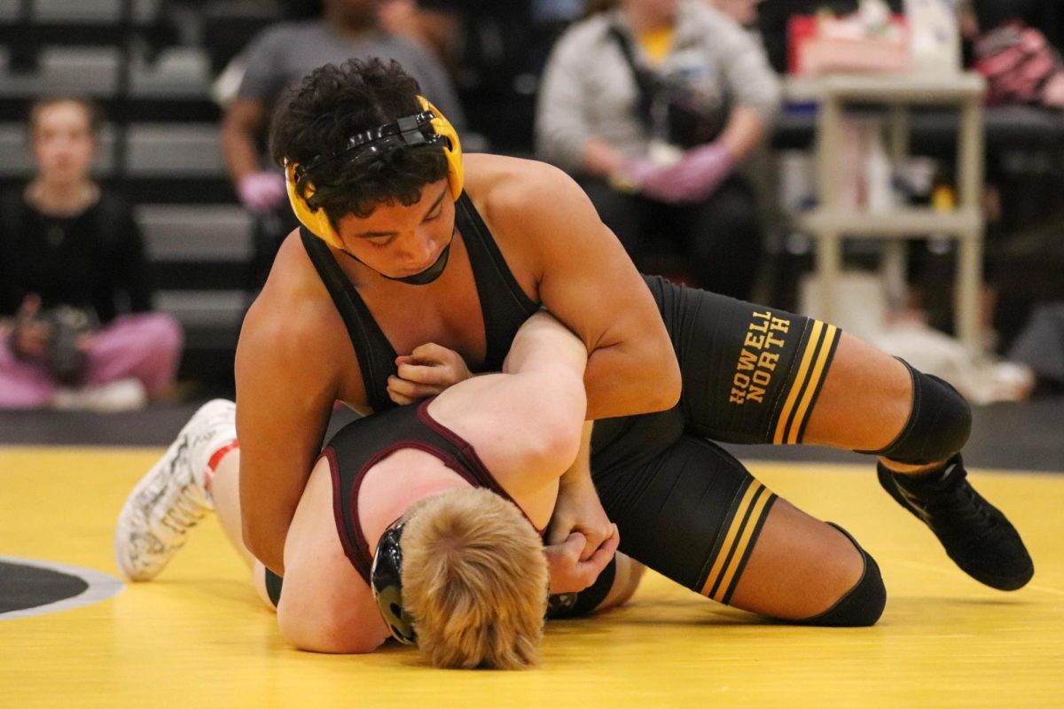 Senior Lito Ledezma takes down Saint Charles West Wrestler.