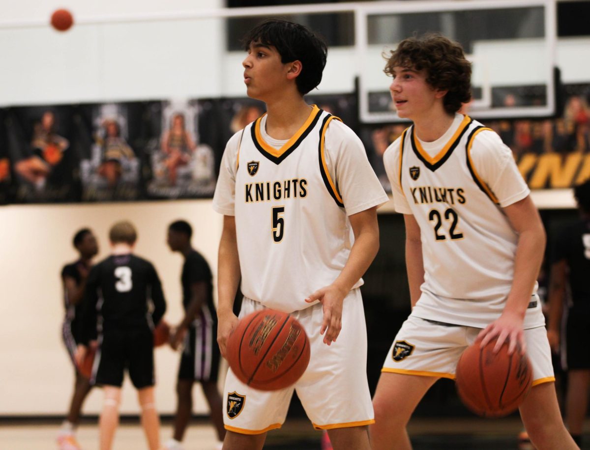 Before the boys C-team basketball game, Girvaan Dangi warms up with Colten Stephenson next to him. The team went on to beat Fort Zumwalt West in a 41-33 victory. 