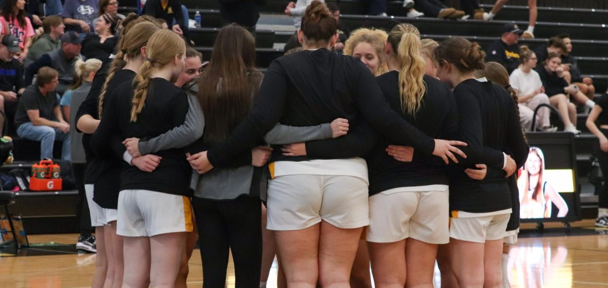 The Lady Knights huddle in a group as they discuss game plans. The girls counted off a chant and ran in line to start the last game of the 2025-2026 season.  
