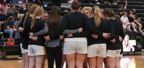 The Lady Knights huddle in a group as they discuss game plans. The girls counted off a chant and ran in line to start the last game of the 2025-2026 season.  

