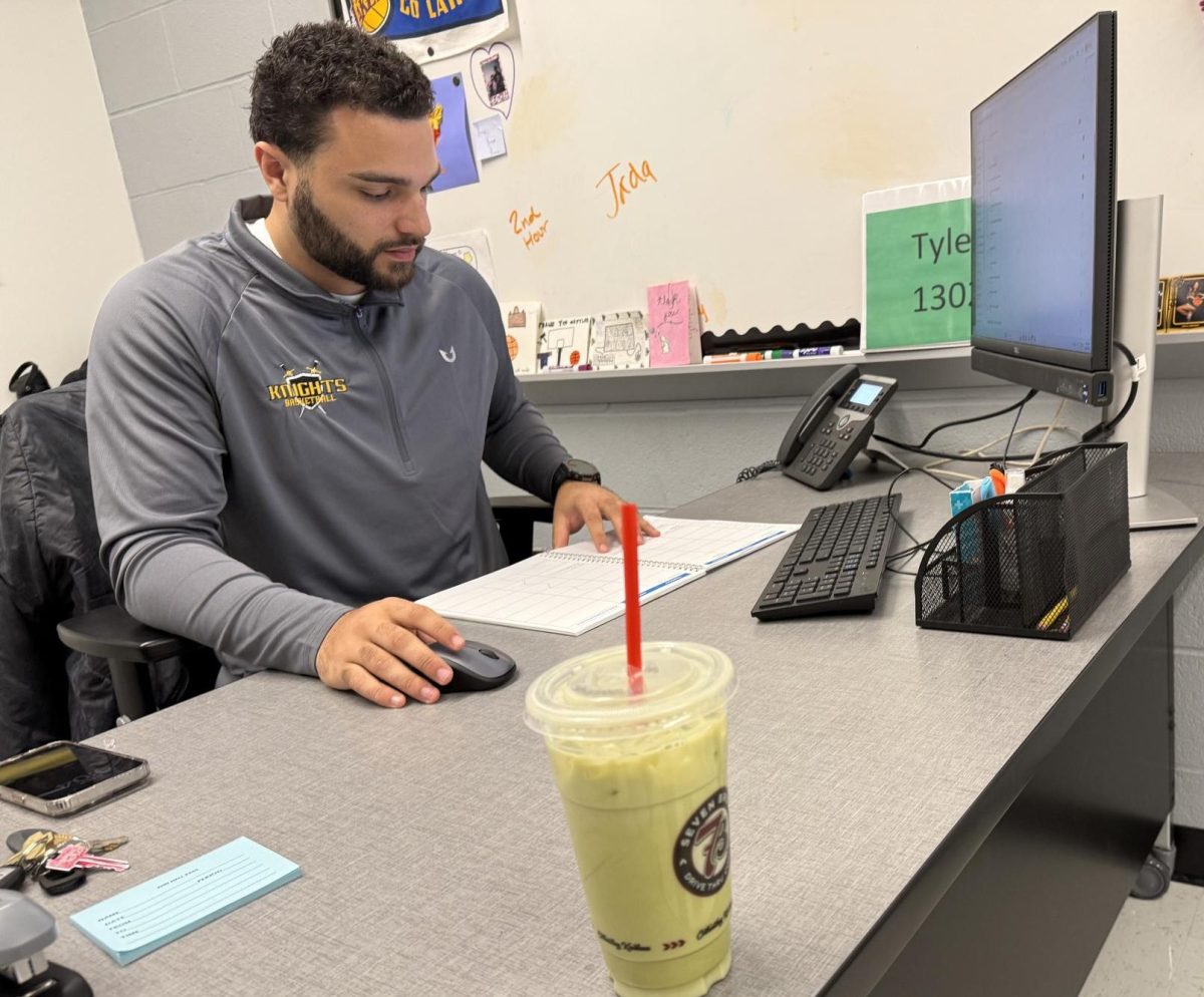Kreighton Tyler works well when sipping his matcha. 7 Brew is one of the many places to get drinks like this to start one’s day.