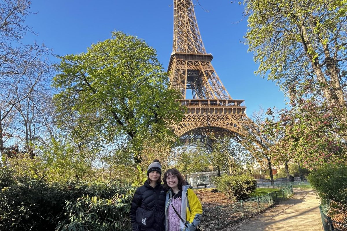 Riley Jensen and her friend posted by the Eiffel Tower in Paris, France.