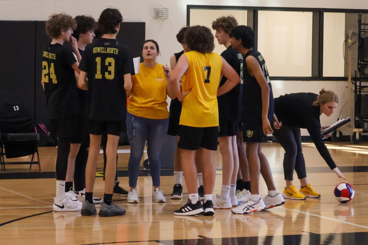 Boys C-Team volleyball huddles at a break between periods at Francis Howell North on March. 19, versus Fort Zumwalt North. The C-Team lost their first two periods and is now talking through the game plan. The strategy change is required, to win the next period for the C-Team.