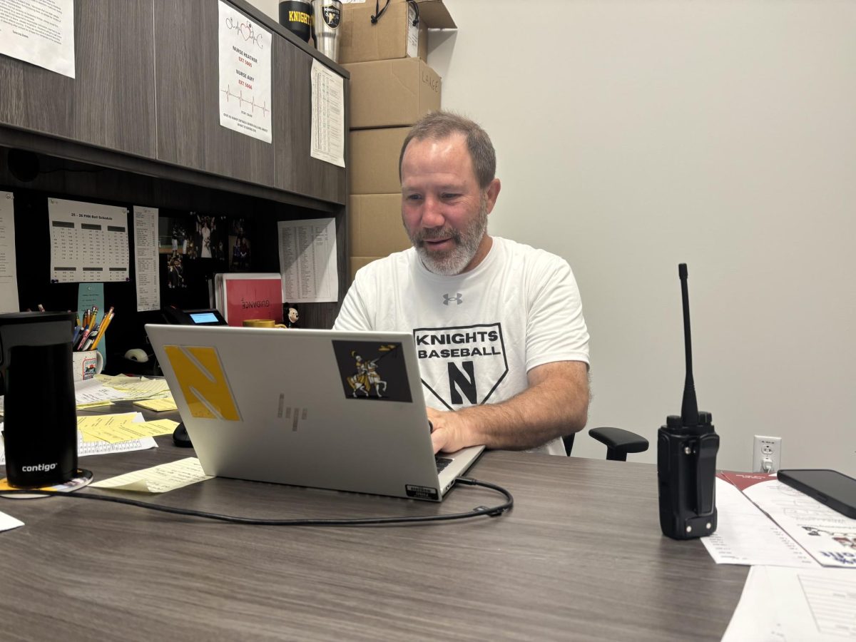 Barry Morrison works in his office to prepare for the day.