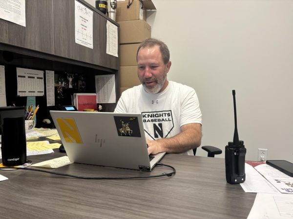 Barry Morrison works in his office to prepare for the day.